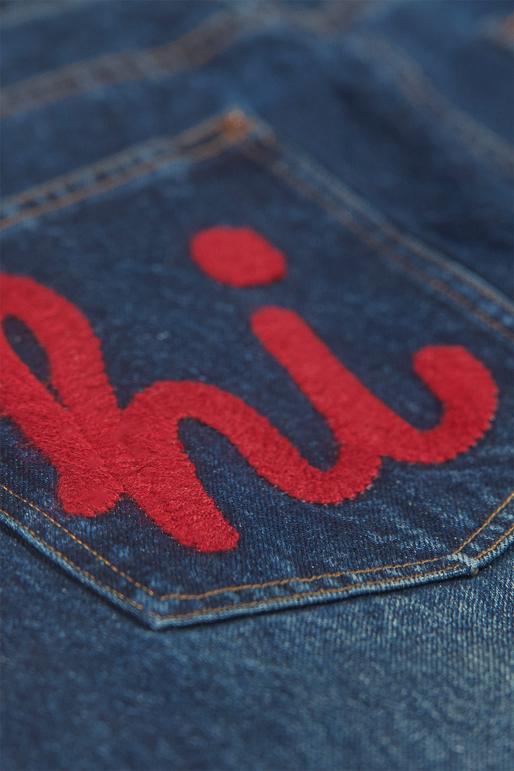 Overlap Embroidered Pocket Jeans